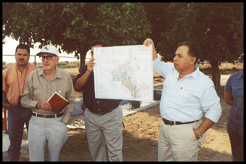 irrigation men holding up map of irrigation canals in the Yaqui Valley