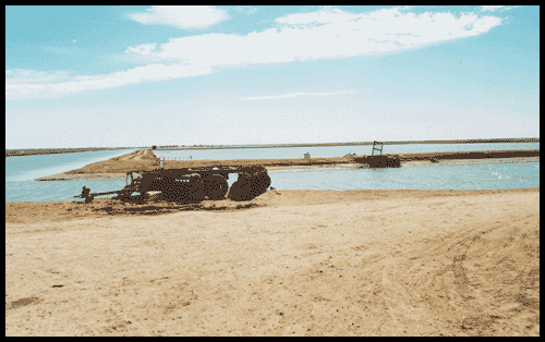 tractor in front of shrimp farm